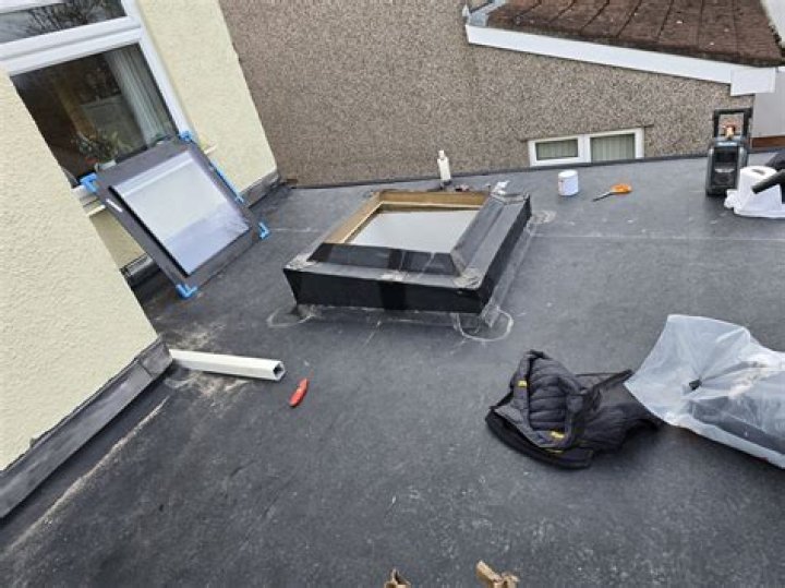flat roof repairs Kingsley, MI